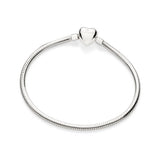Silver-plated jewelry by Rommanel featuring a flexible snake chain bracelet centered on a white background with a signature heart-shaped clasp, an engraved butterfly logo, and a reflective polished finish