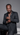 Black man in a black suit wearing silver tennis necklaces, a cross pendant, and iced-out bracelets for the Rhythm Collection.