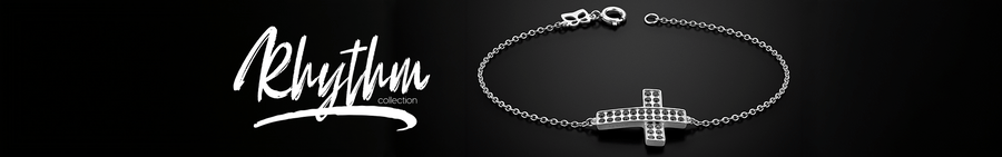 Silver chain bracelet with a black cubic zirconia cross charm for the Rhythm Collection.