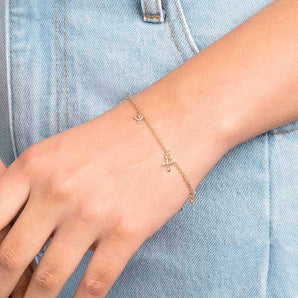GOLD CROSS AND DOVE BRACELET