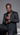 Black man in a black suit wearing silver tennis necklaces, a cross pendant, and iced-out bracelets for the Rhythm Collection.